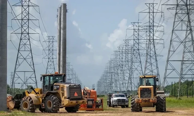 Service technicians work to install the foundation for a transmissiontower.